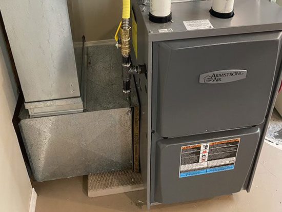 Man Checking an Air Conditioner<br />
